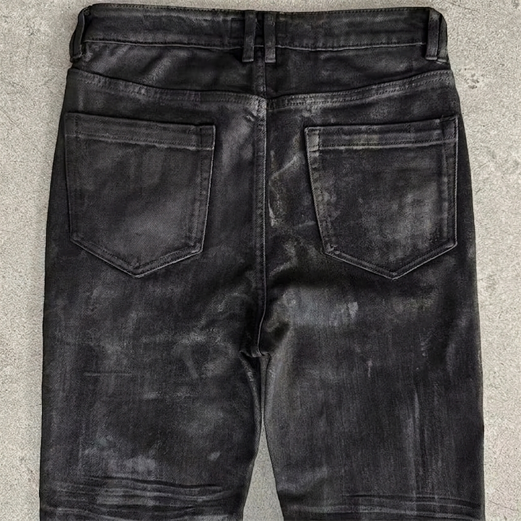 ITAMI WAX DENIM SLIM FLARE — detail macro shot of wax coating and pocket